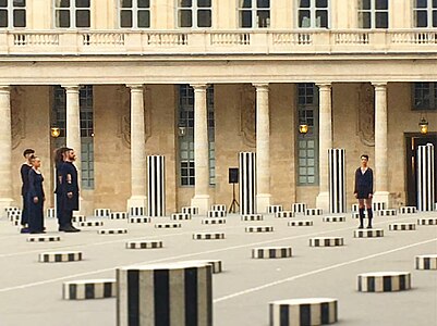 Dancers of the Nathalie Pernette company perform her dance piece La Figure du Baiser in May 2017 within the Columns of Buren at the Palais-Royal.[56]