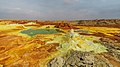Image 4 Dallol Photograph credit: Alexander Savin Dallol is a cinder-cone volcano in the Danakil Depression, northeast of the Erta Ale Range in Ethiopia. The area lies up to 120 m (390 ft) below sea level, and has been repeatedly flooded in the past when waters from the Red Sea have inundated it. The Danakil Depression is one of the hottest places on Earth, and the evaporation of seawater after these flooding episodes produced thick deposits of salt, as seen in this landscape. The deposits at Dallol include significant quantities of the carbonate, sulfate and chloride salts of sodium, potassium, calcium and magnesium. Hot springs discharge brine to form the blueish ponds, and small, temporary geysers produce cones of salt. More selected pictures