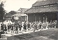 Enthronement of Emperor Bảo Đại in the Imperial City in 1926 with the Emperor's palanquin escorted from Hall of Diligent Governance (Điện Cần Chánh) to the Throne Hall