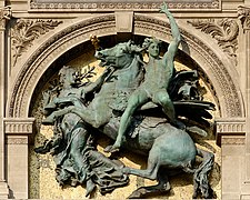 The Genius of Arts by Mercié. Can be seen on the façade of the Louvre facing the river Seine, Paris.