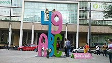 A giant sculpture that reads "49 ABC". Next to it, the phrase "never again" is written in Spanish.