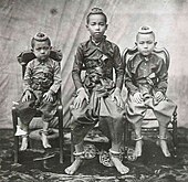 Photograph of Prince Chulalongkorn (Rama V) and his two younger brother wearing chong kraben in 1851