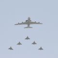A Boeing E-3 Sentry (AWACS) followed by five Mirages 2000