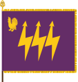 The traditional colour of the Eastern Finland Signals Battalion, part of the Karelia Brigade, has the branch colours of signals corps: purple and gold. The device featuring a western capercaillie is a throwback to the earlier designation as Central Finland Signals Battalion. The main device, the three lightning bolts, is symbolic of communication.
