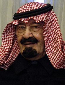 Abdullah, aged 83, wears glasses and a traditional Arabian headdress.