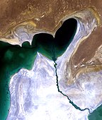 July 2010 – A closeup of the channel leading from the re-flooded Eastern Sea to the Western Sea. The white areas are the exposed salt flats of the new Aralkum desert.