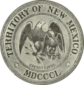 Greyscale drawing of a seal shows 'Territory of New Mexico', 'MDCCCL', and 'crescit eundo' in rings around the edge (separated by crosses patoncé); in the center an American heraldic eagle holding three arrows protects a smaller Mexican heraldic eagle holding a snake and sitting on a nopal.
