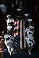 A casket team carries Major Douglas A. Zembiec, former commander of E Company, 2nd Battalion, 1st Marine Regiment from the Naval Academy Chapel in Annapolis, Maryland following the funeral service.