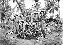 Soldiers pose for a photograph prior to a jungle patrol