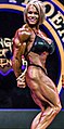 Aleesha Young doing a side triceps pose pose at the 2017 Rising Phoenix World Championships.
