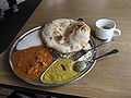 Tandoori roti served with other dishes in an Indian restaurant