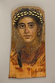 Portrait of a young woman in red; c. 90–120 ; encaustic painting on limewood with gold leaf; height: 38 cm (15 in); Metropolitan Museum of Art (New York City)