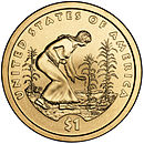 2009 US Sacagawea dollar coin depicting a woman in a buckskin tunic planting seeds among cornstalks and squash plants