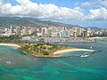 Aerial view of Honolulu with Magic Island in the foreground.