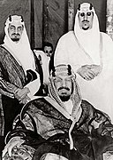 King Abdulaziz (seated) with his sons Faisal (left) and Saud, early 1950s.