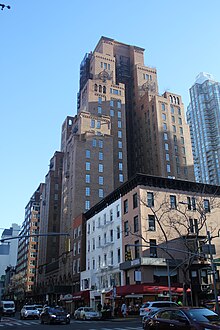 The Barbizon, a 23-story brick building, as viewed from the corner of 62nd Street and Lexington Avenue. There are several 4- and 5-story buildings to the right of Lexington Avenue, in front of the Barbizon.