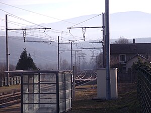 Shelter on side platform next to double-track railway line
