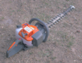 A gasoline-powered hedge trimmer