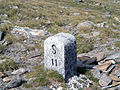 Border stone at Passo San Giacomo between Val Formazza in Italy and Val Bedretto [it] in Switzerland