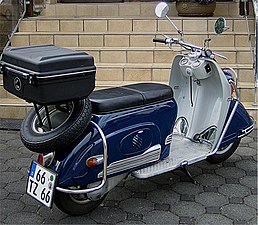 1956 Heinkel Tourist. This scooter had a frame-mounted engine and a swingarm with an integral chain enclosure.