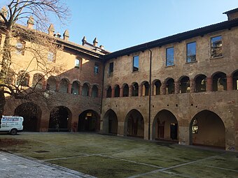 A massive brick courtyard with porch and loggia, also used for public assemblies.