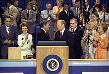 Reagan and Gerald Ford shaking hands on the podium after Reagan narrowly lost the nomination at the 1976 Republican National Convention