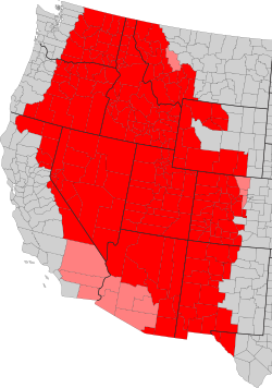 Map of the Intermountain West by county. Counties in red are always included, while counties in pink are only sometimes included.