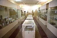 One of the halls of the Erbil Civilization Museum displaying artifacts from the Urartian, Hurrian, Assyrian, and Hatra periods. Iraqi Kurdistan.