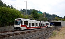 a Red Line train exiting a tunnel