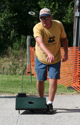 A player tosses a washer during a washer pitching tournament in Indiana