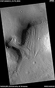 Two glaciers interacting, as seen by HiRISE under HiWish program. The one on the left is more recent and is flowing on top of the other one.