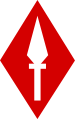 A white spearhead pointing up, on a scarlet diamond.
