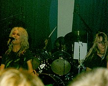L7 onstage, Donita Sparks (left), Demetra Plakas (center), and Gail Greenwood (right)
