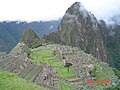 Machu Picchu ruins, Huayna Picchu peak in the background.