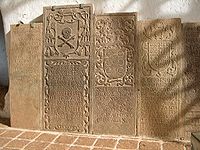 Gravestone (second from the left), in Malacca's St. Paul's Church, of Peter Martinez consecrated as the second bishop of Japan in Goa, 1595 and arrived in Nagasaki, 1596. He left in 1597 following the deaths of the 26 Martyrs of Japan. Died en route to Goa in February 1598.[7]