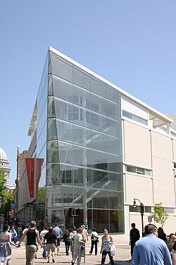 MMoCA building with its glass facade and Icon staircase on the corner of State St. and Henry St.