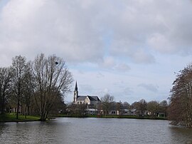 The church of Saint-Nicolas, seen beyond the water from Mûrier