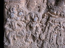 Stone carving of woman playing Tabla at Bhaje caves