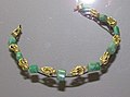 Collar; emerald stones and gold nodes