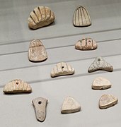 Clay tokens; circa 3500 BC (Susa II or "Uruk period"); terracotta; from Susa; Louvre (Paris)