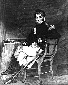 Commodore David Porter in full naval dress sitting in a chair next to a table.