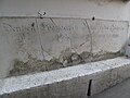 The dedication stone of the original sanctuary written in German.