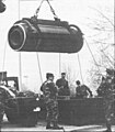 Soldiers removing a motor from its container in an operation like the 1985 incident