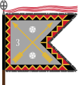 The traditional colour of the Kymi Jaeger Battalion, today a part of the Karelia Brigade, is of the form defined for light infantry. The Kymi Jaeger Battalion follows the traditions of the 3rd Bicycle Battalion and carries that number on its colour, and the Order of the Cross of Liberty both as a streamer and as the point of the staff.
