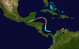 The path of a tropical cyclone, as represented by colored dots, denoting the storm's intensity and position at six-hour intervals. Starting slightly right of center, the track moves up, before turning left and then to the bottom-left corner of the map.