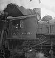 An IC steam locomotive taking on coal at a Chicago rail yard in November 1942