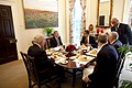 In the Oval Office Private Dining room, a new painting replaces an old one which is now on the opposite wall.