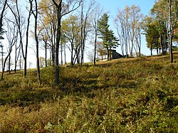 The site of Pithole in October 2009. The visitor center is visible at the top of the hill.