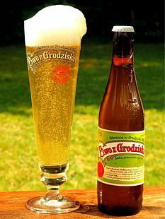 Piwo z Grodziska in a bottle and in a glass