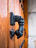 Hand-shaped door knocker in Spain